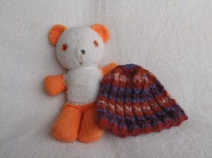 My first teddy bear, posing here with a knitted toque